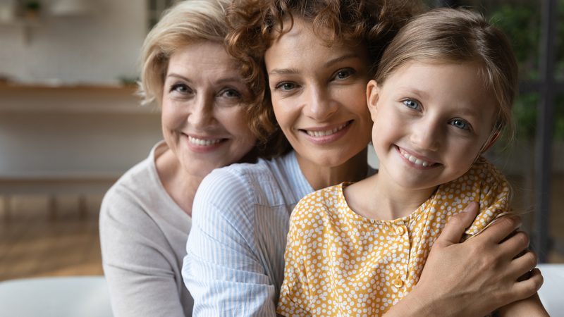Three generations of women embracing